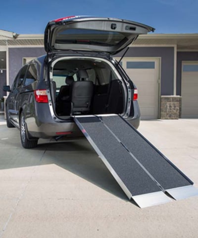 a portable ramp on the back of a vehicle