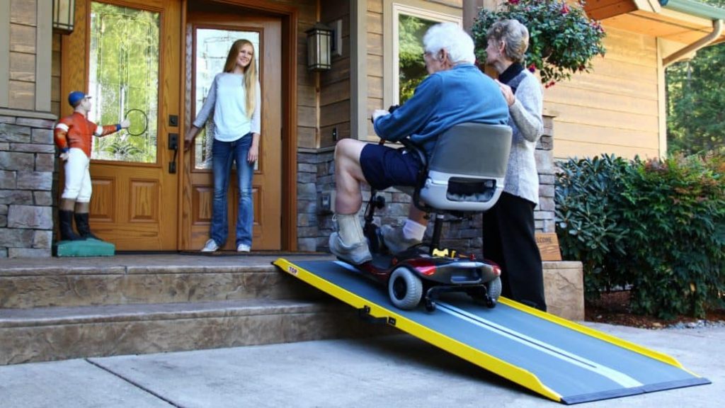 a man going up a wheelchair ramp