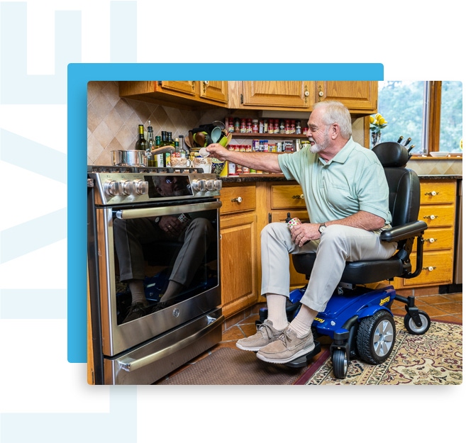 man in wheelchair cooking in the kitchen