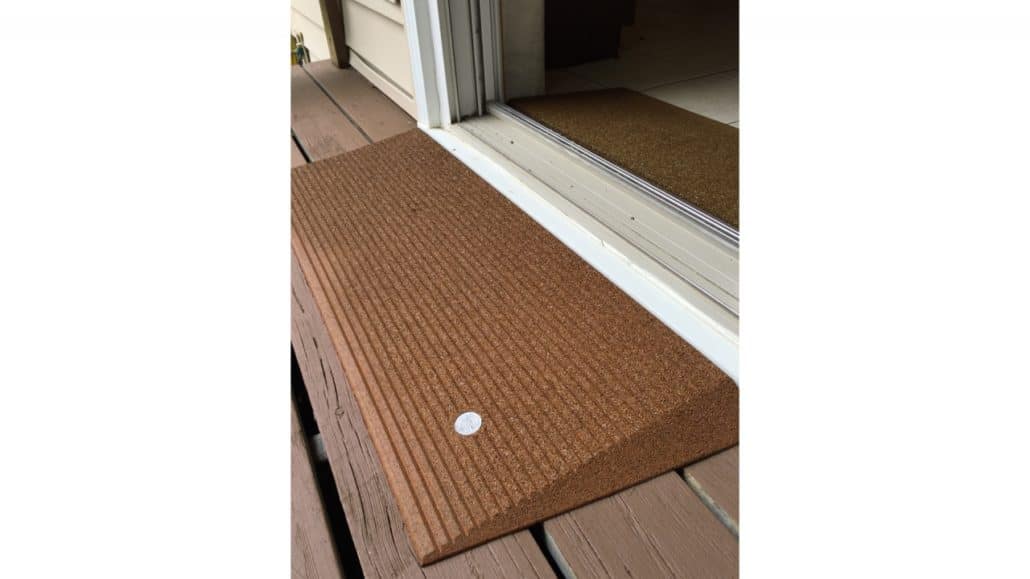 An angled mat entry in front of a door