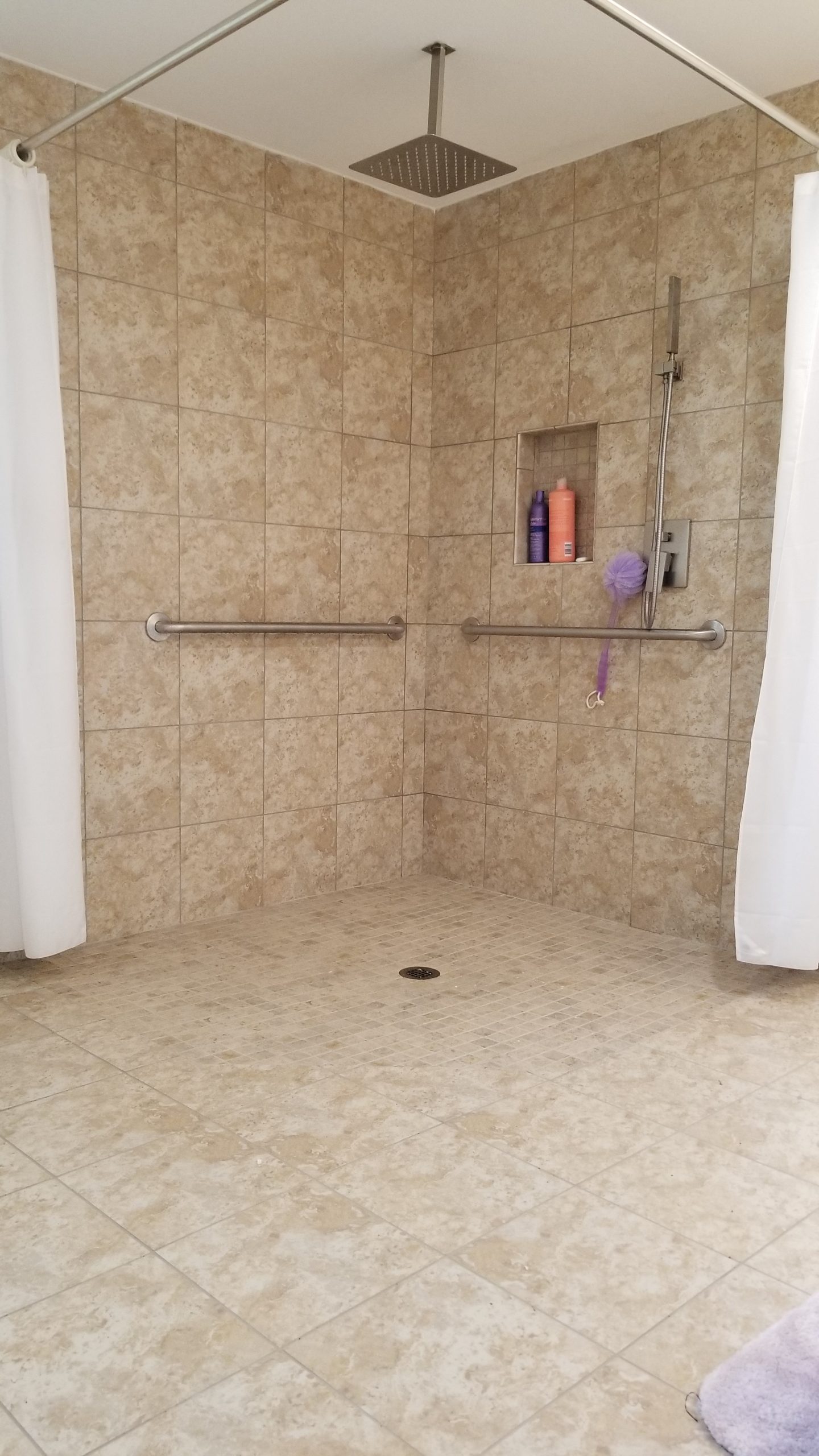 The Barrier Free Walk-In Shower System in a shower