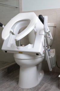 The EZ-ACCESS TILT® Toilet Incline Lift installed on a toilet