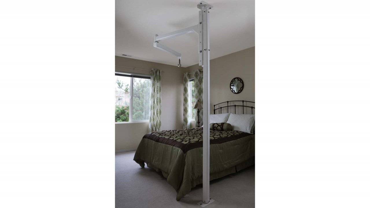 The orbit in a bedroom with grey bedding