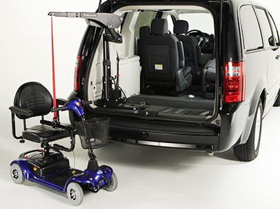 A scooter that's attached to a Big Lifter and a car
