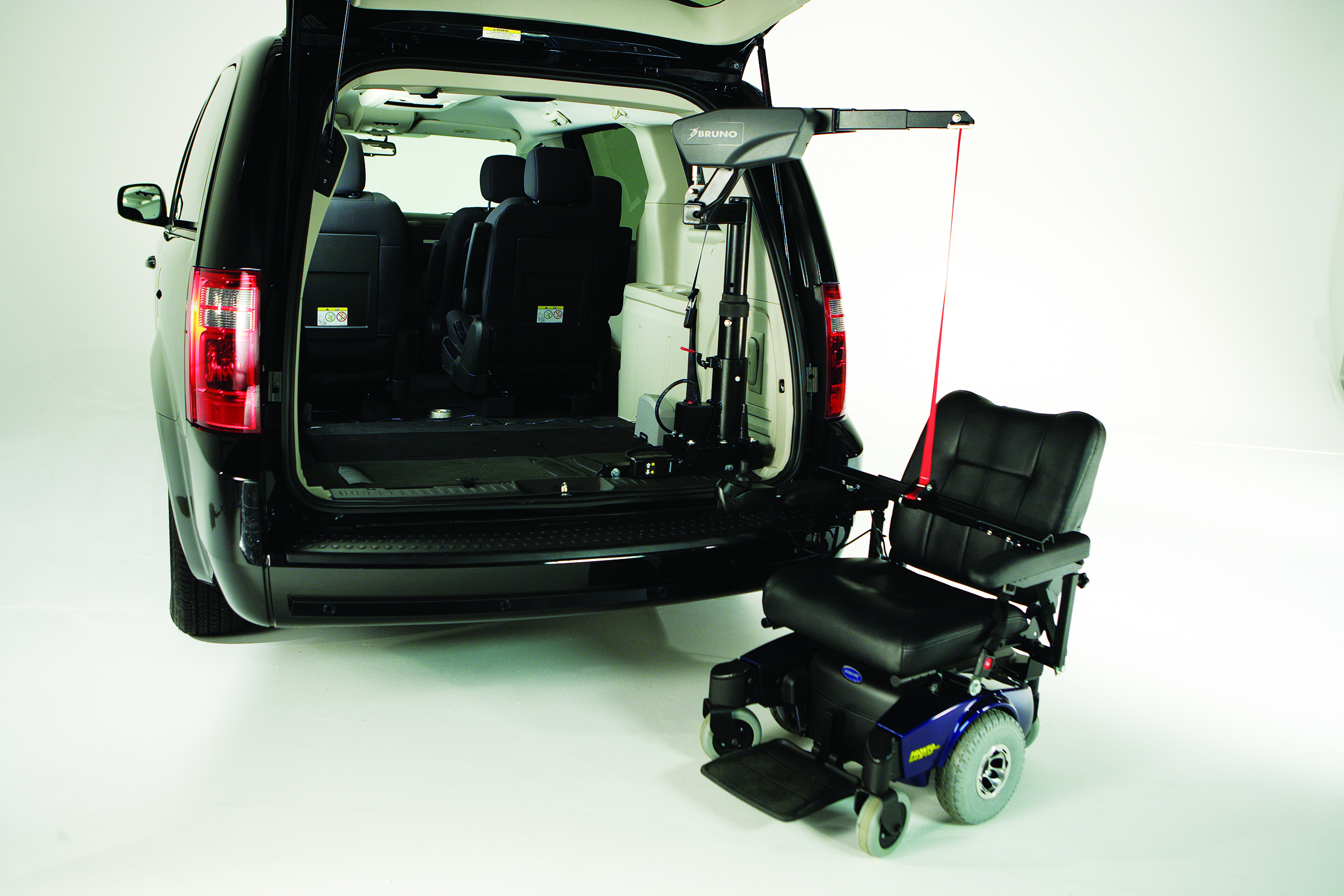 A scooter that's attached to a Big Lifter and a car