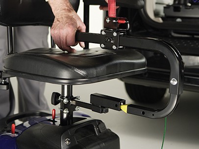 A man showing how the Big Lifter connects to a scooter