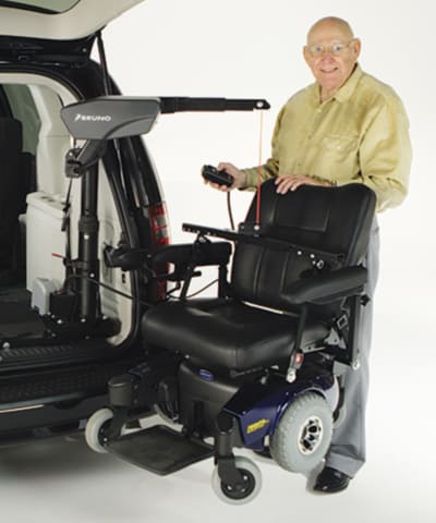 A scooter that's attached to a Big Lifter and a car