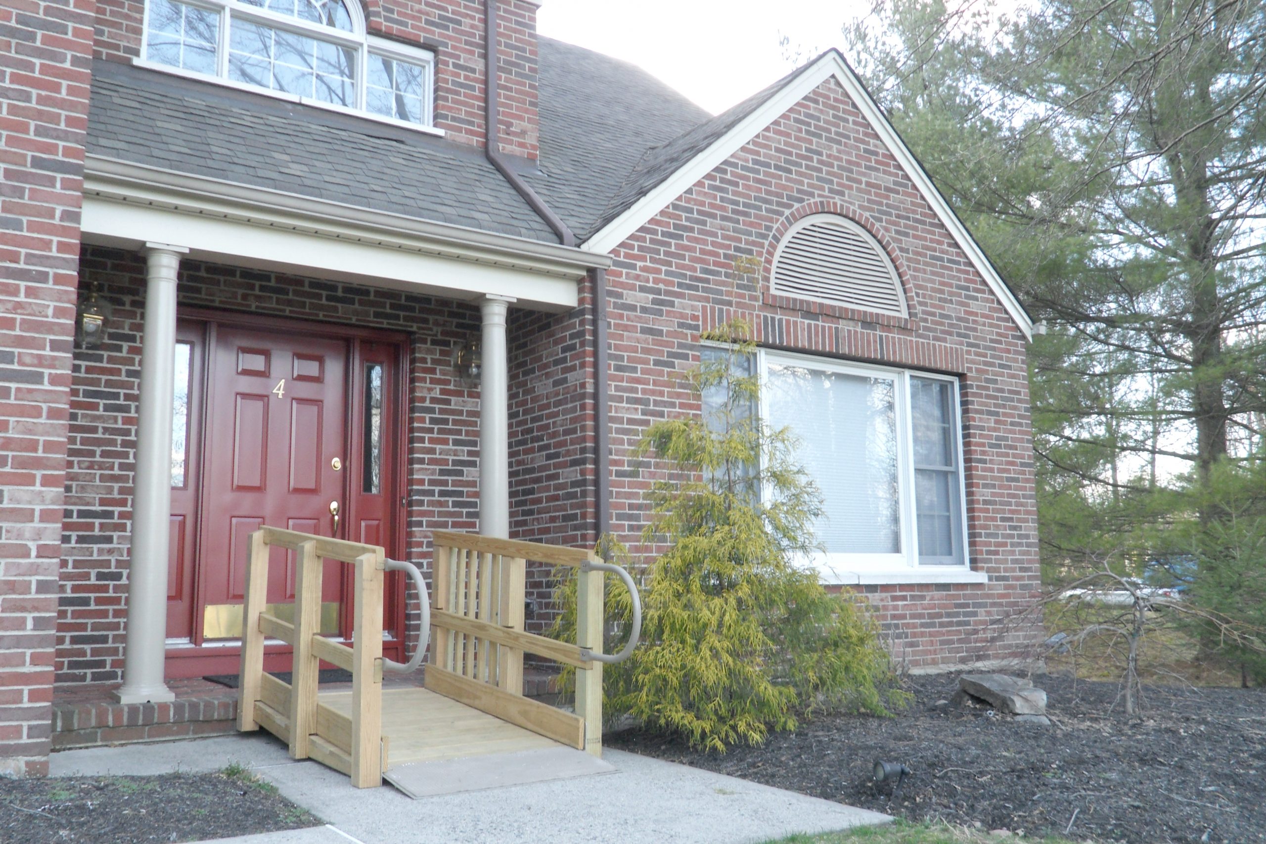 Wood Deck Ramp in front of a brick building