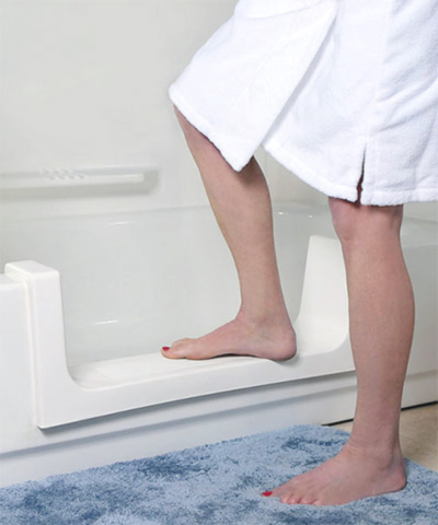 A person using the Safeway Step to walk into a shower