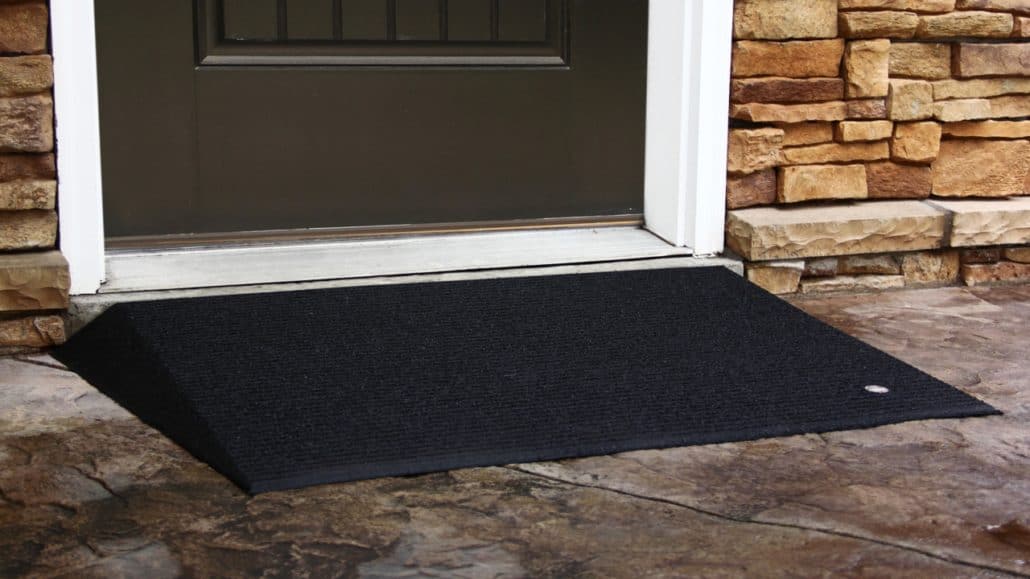 An angled entry mat in front of a door