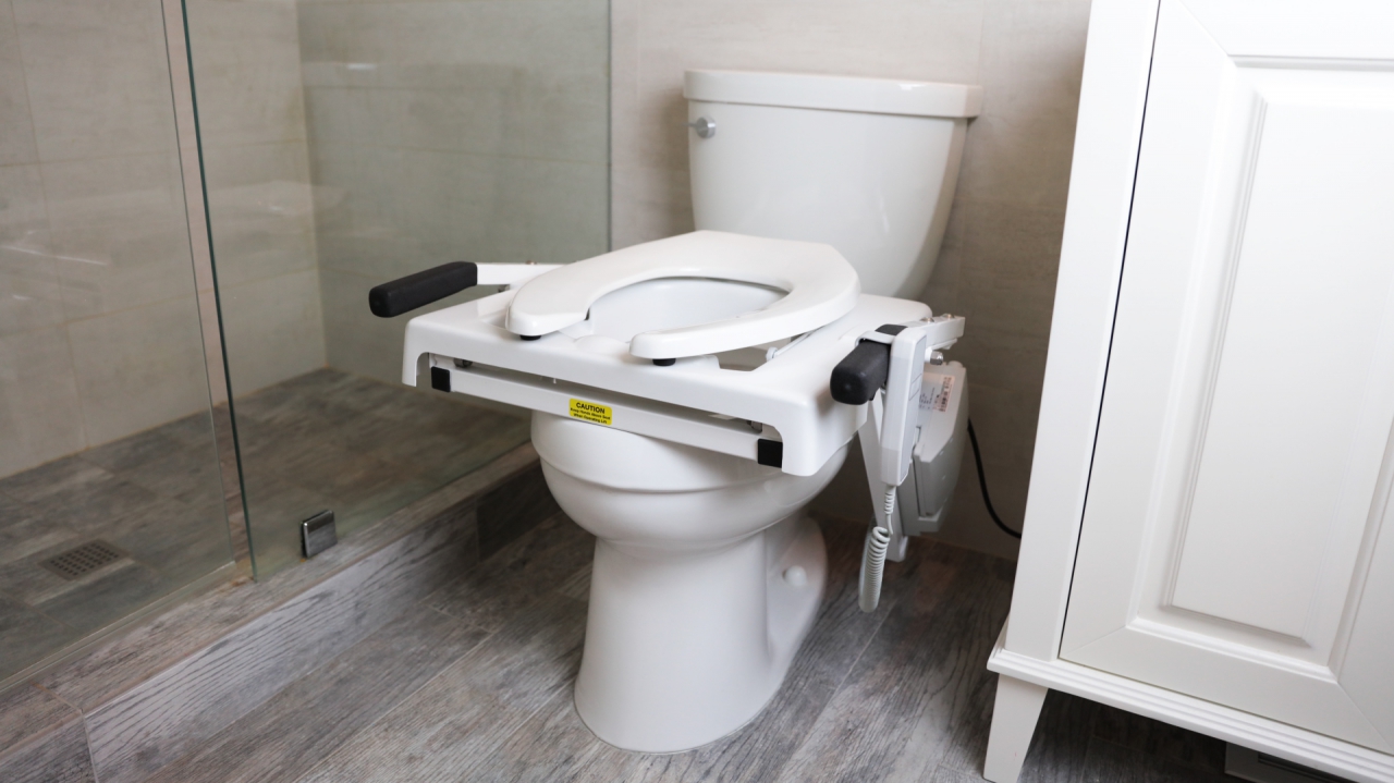 The EZ-ACCESS TILT® Toilet Incline Lift installed on a toilet