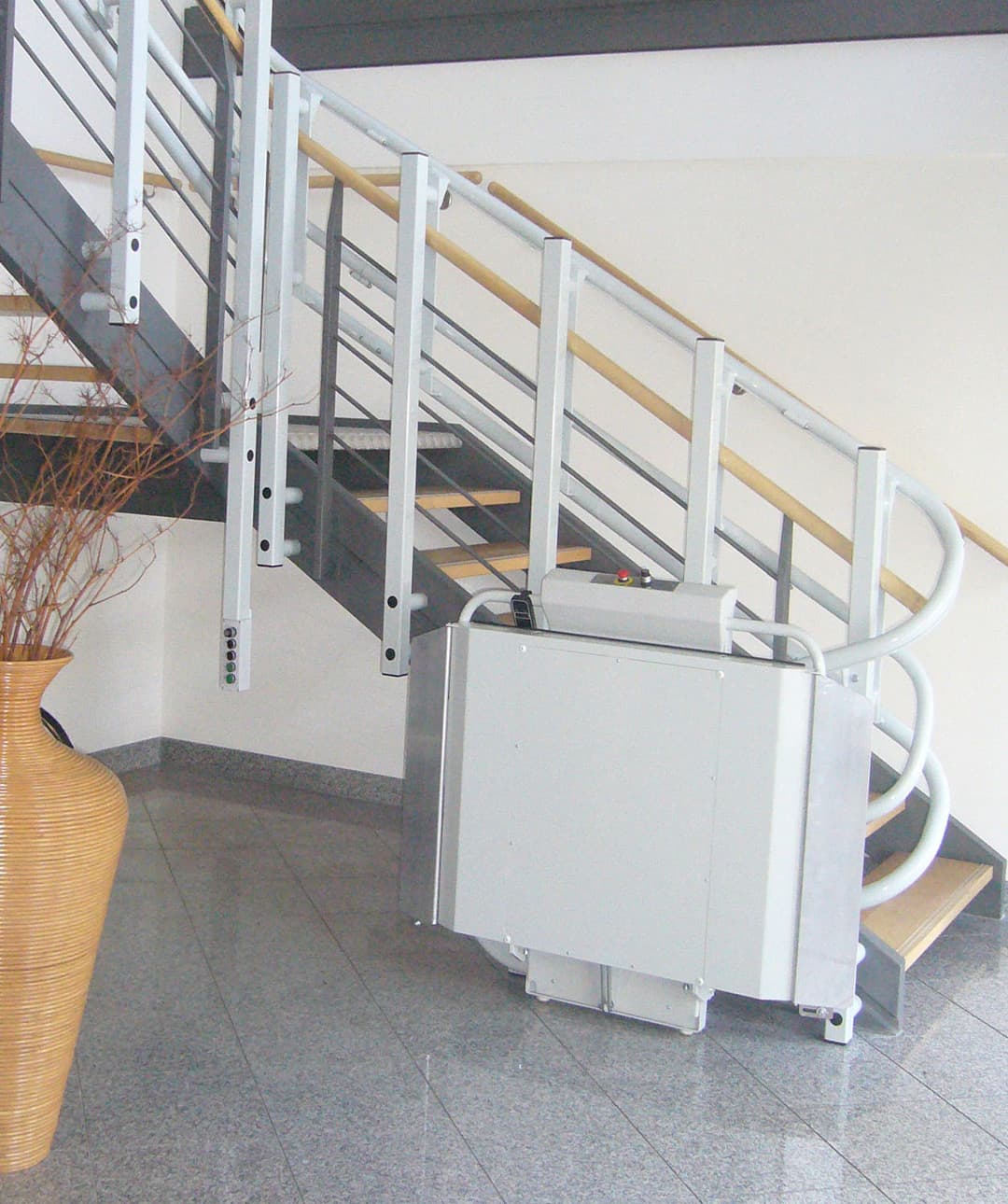 A platform lift leading up stairs