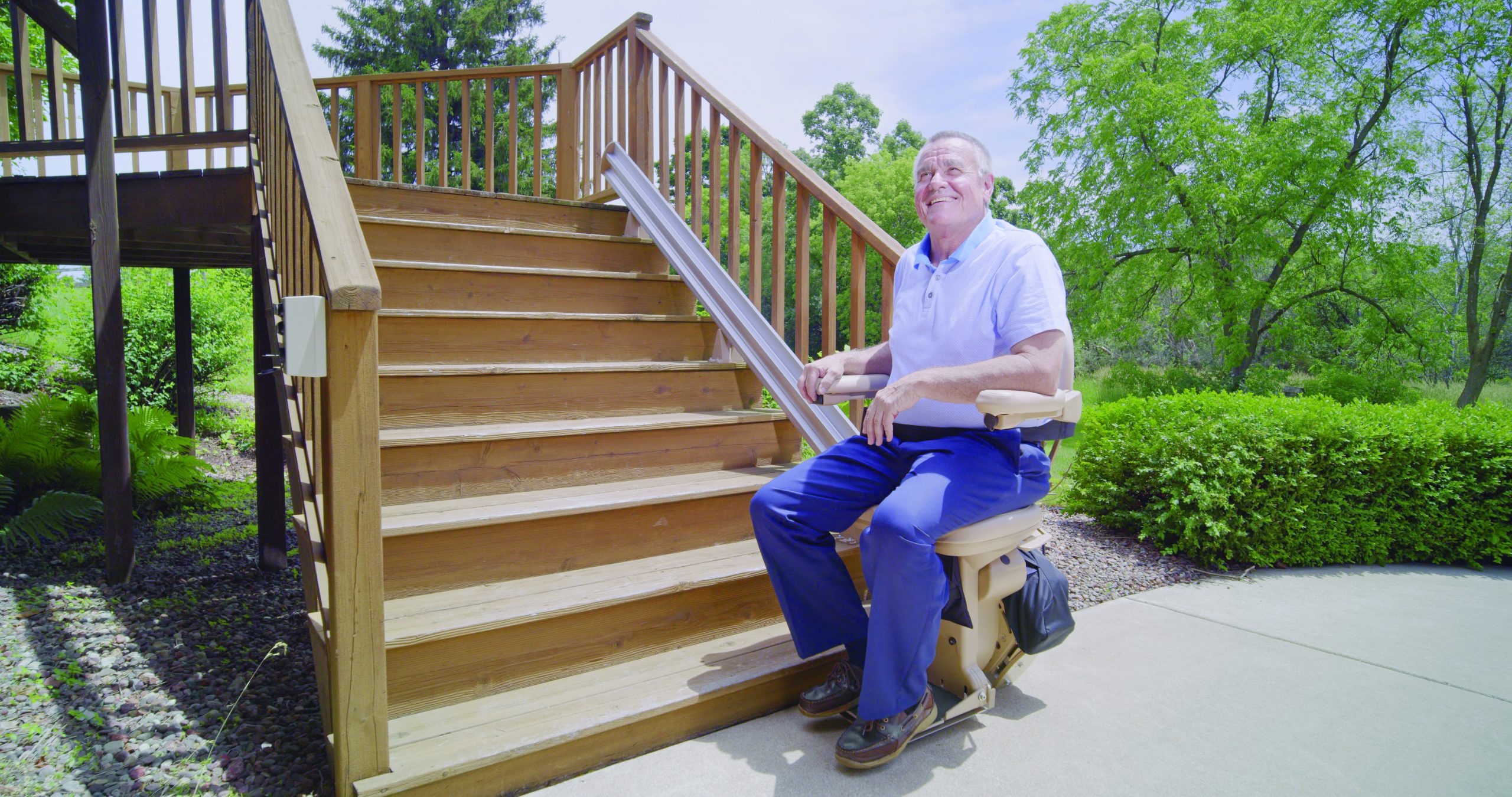 Man sitting on outdoor bruno stairlift