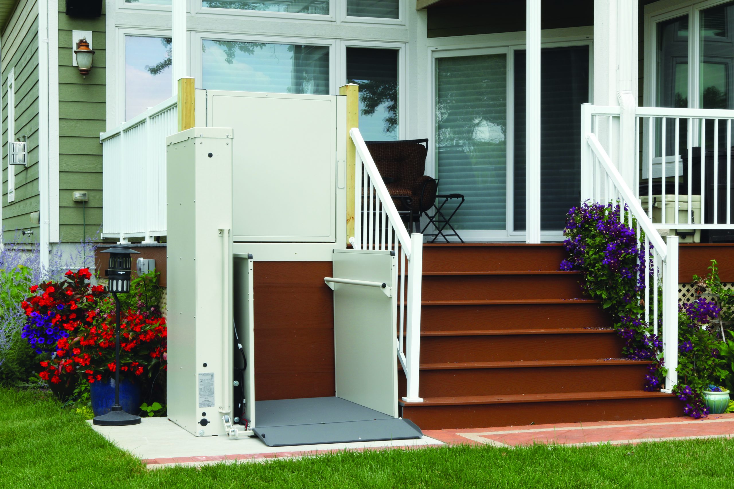 The Bruno Residential Vertical Platform Lift installed on stairs outside