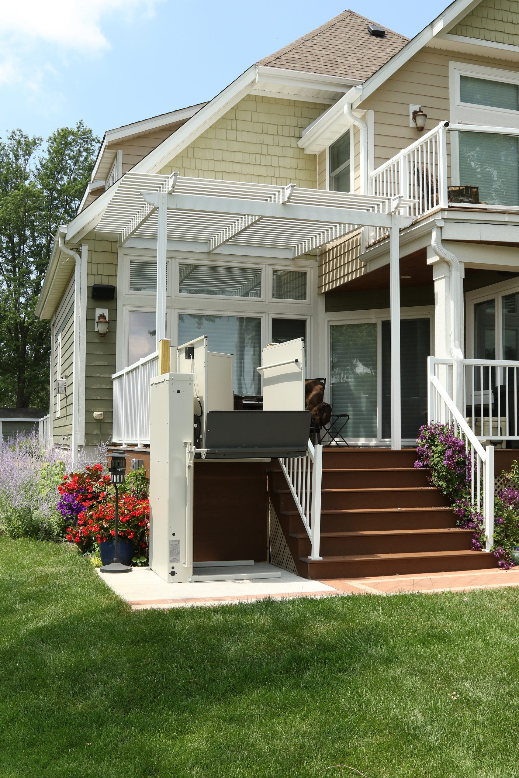 The Bruno Residential Vertical Platform Lift installed on stairs outside
