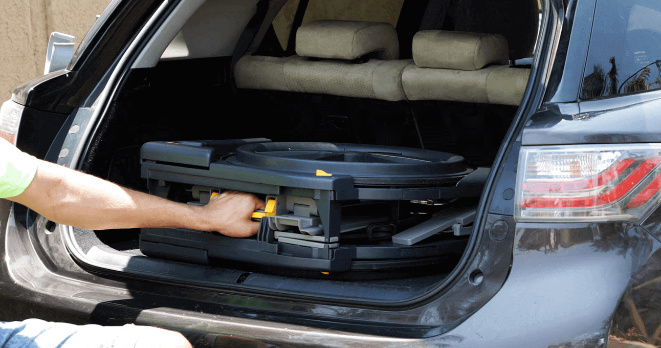 The Seatara WheelAble Toilet and Shower Chair being put into a car's trunk