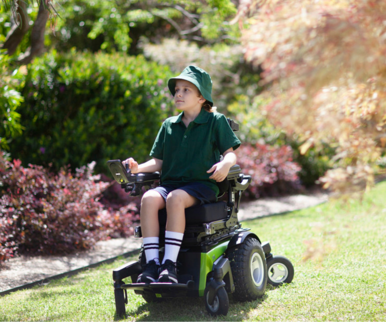 boy in complex power wheelchair