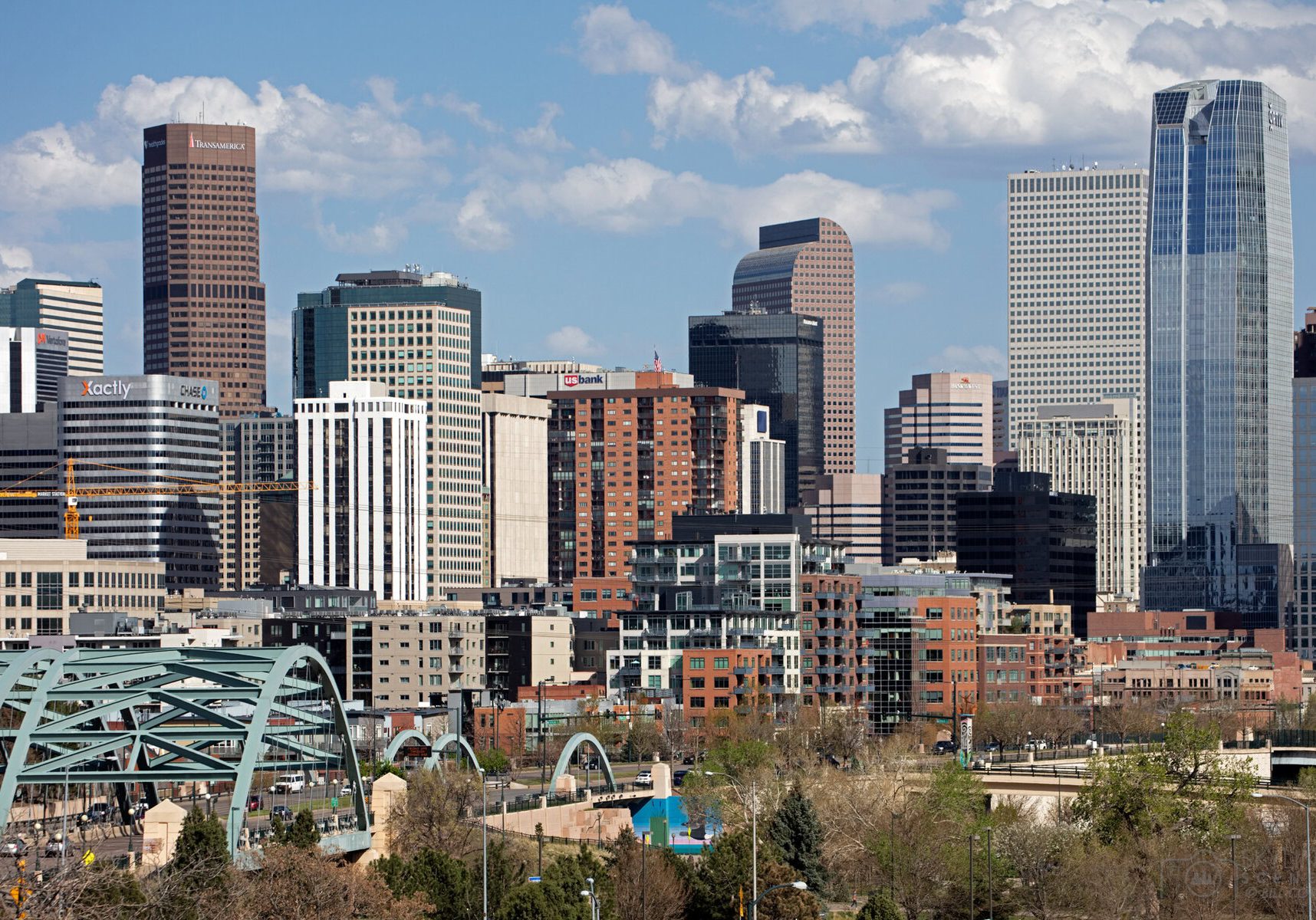 The Skyline of Denver Colorado with 1144 Fifteenth at right and the Platte River Bridge in the foreground