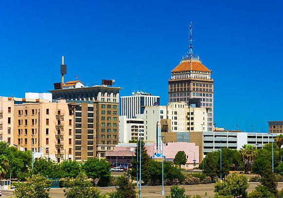 Fresno downtown skyline view with a clear blue sky in the background.